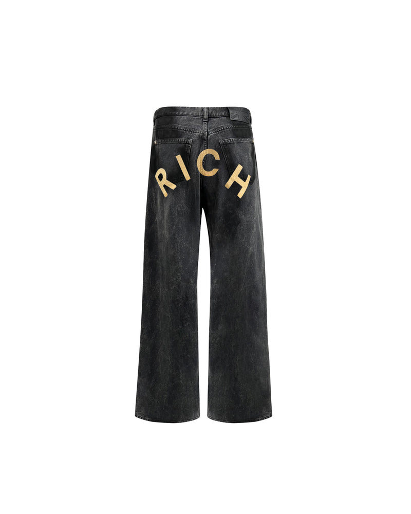 Jeans super baggy in denim nero con personalizzazione "RICH" glitter gold