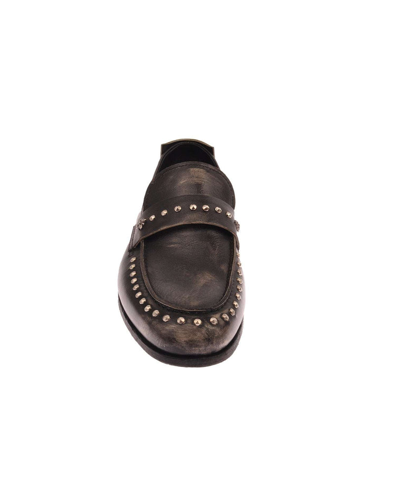 Moccasin with metal applications on the front